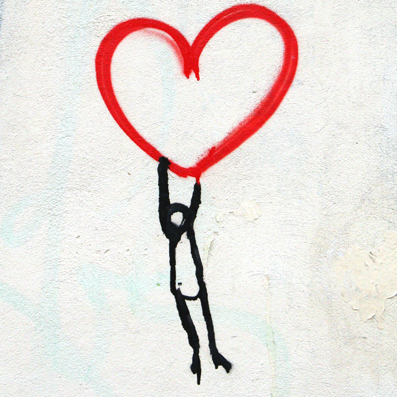 Drawing of a person hanging onto a heart that is floating away
